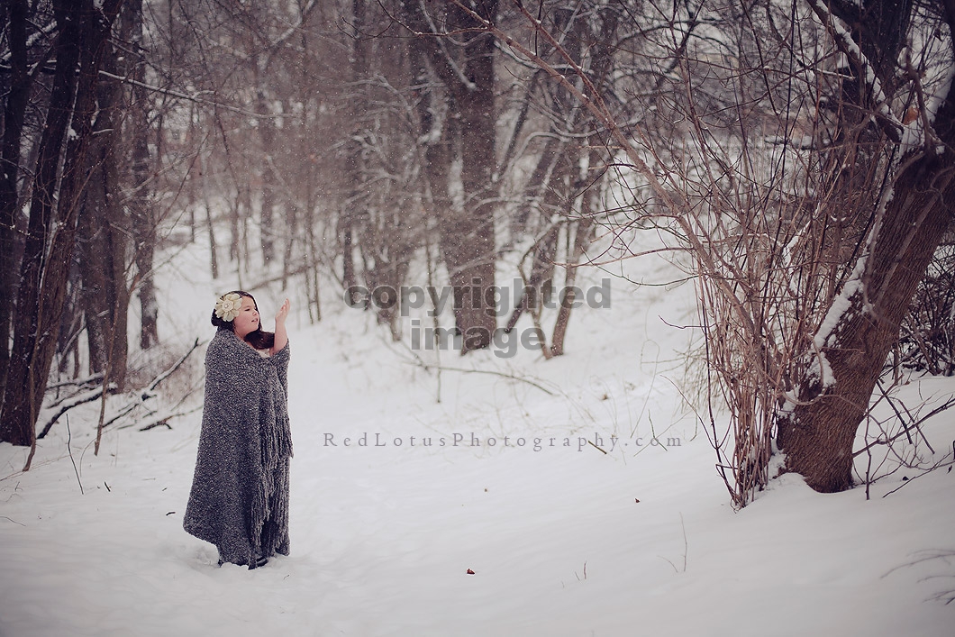 portrait of girl in snow in the woods