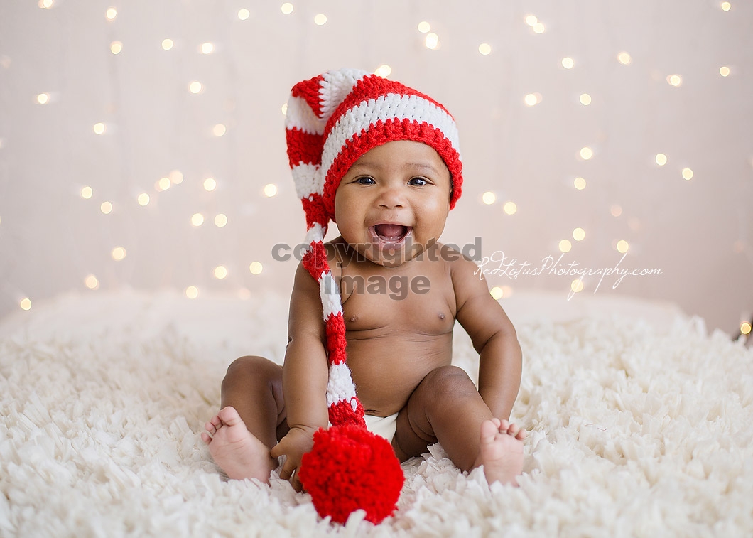 baby with Christmas lights