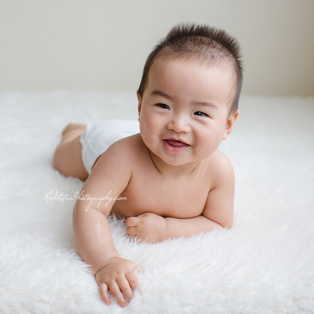 8-month old smiling baby on a neutral backdrop by Pittsburgh photographer
