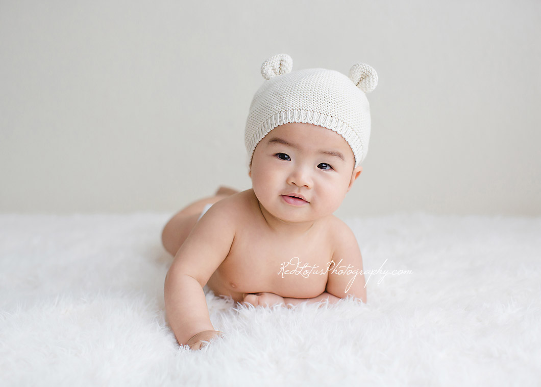 Adorable baby photos on a neutral backdrop